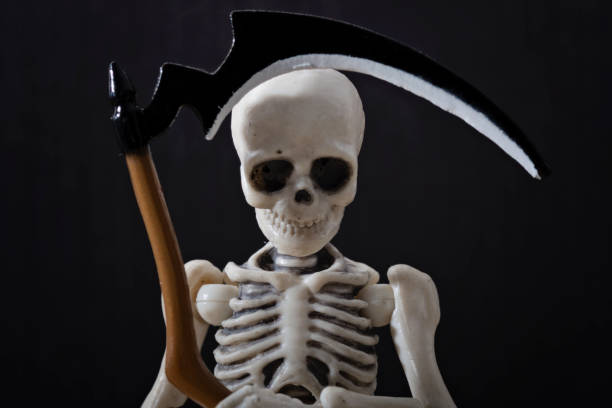 istock The death holding scythe 856979322