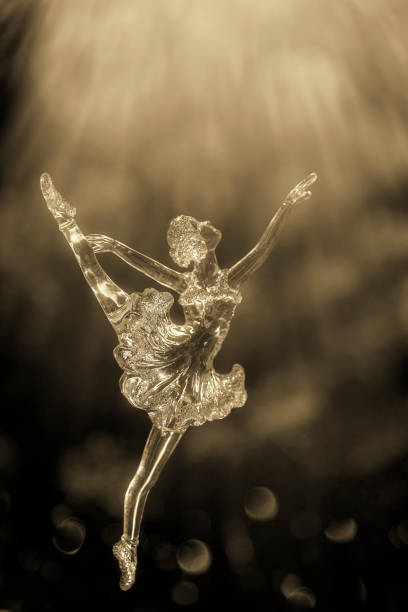 istock Glass ballet dancer on Dark background. Old style. Selective focus 856979928