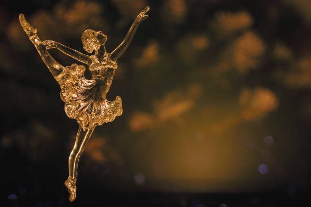 istock Glass ballet dancer on Dark background. Old style. Selective focus 856979994