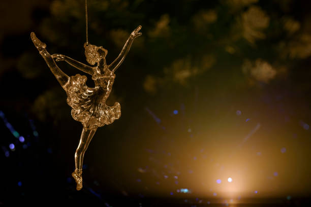 istock Glass ballet dancer on Dark background. Old style. Selective focus 856980160