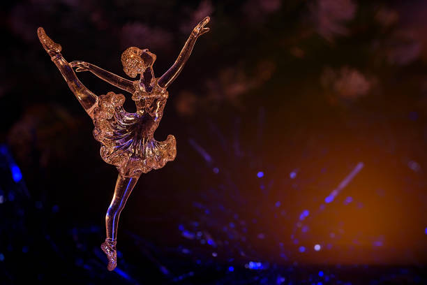 istock Glass ballet dancer on Dark background. Old style. Selective focus 856980462