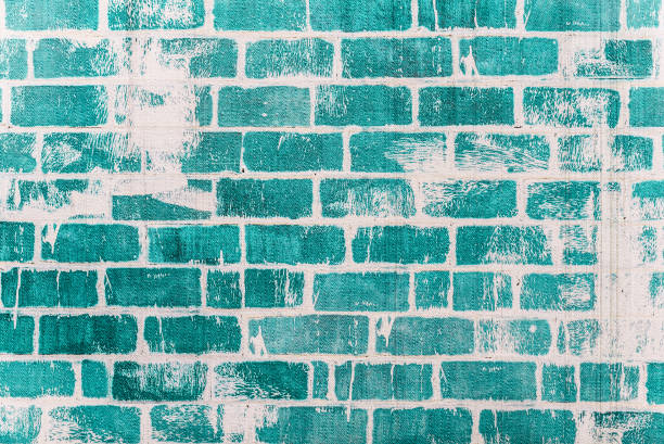 Green brick wall texture industrial background for commercial use. Rough grunge blue texture imitation of old, used, weathered, brick wall. High resolution picture.