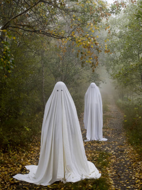istock Two scary ghosts in the woods 856981126