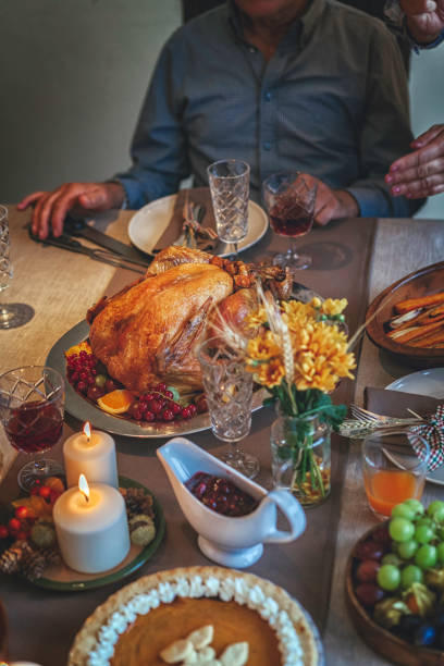 istock Family Having Traditional Holiday Stuffed Turkey Dinner 856981294
