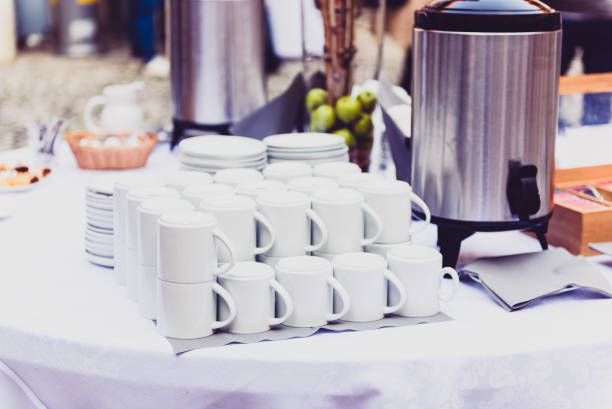 Coffee, cups on catering table at conference or wedding banquet.
