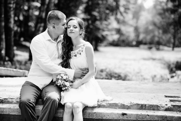 istock Groom fixes his blue bow tie standing before the bride on old st 856983882