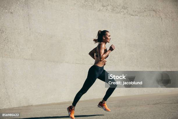 Healthy Young Woman On Morning Run Stock Photo - Download Image Now - Running, Women, One Woman Only