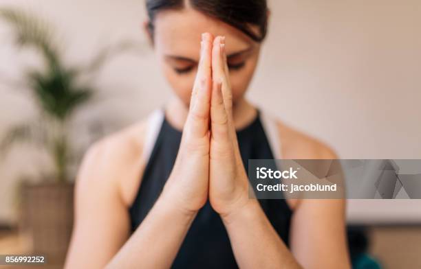 Woman In Namaste Yoga Pose Meditating Stock Photo - Download Image Now - Hand, Human Face, Yoga