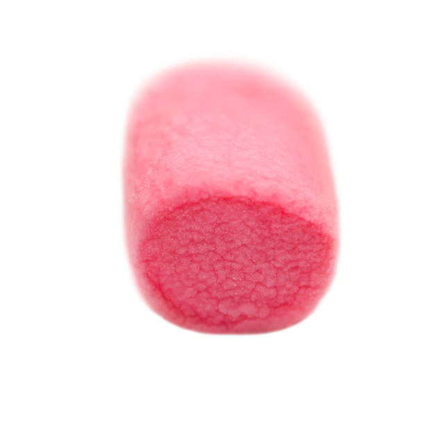 istock One Fluffy colorful  marshmallow macro isolated over white background. Rink soft marsmallow