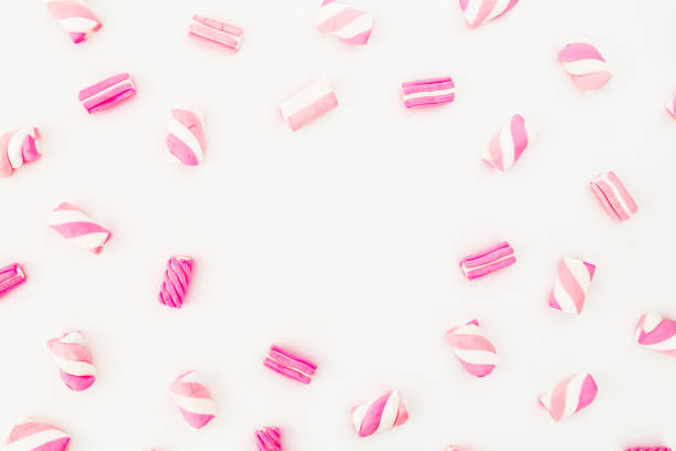 istock Pattern of colorful pink marshmallow on white background. Candy concept. Flat lay, top view 856996894