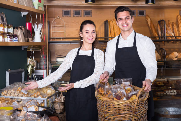 istock Man and woman bakers in bakery 857000976