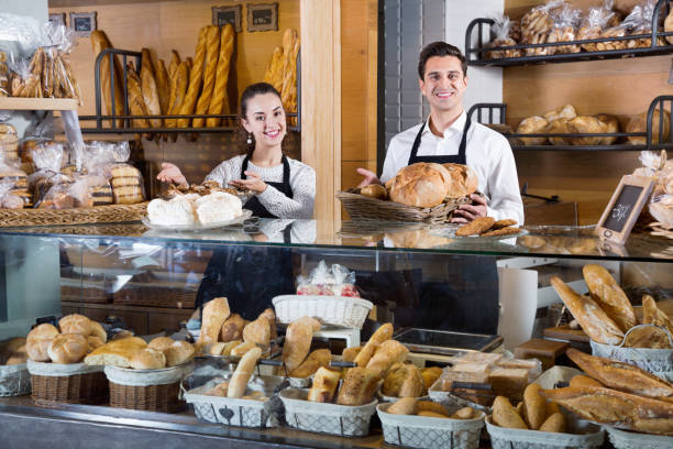 istock Portrait of charming pleasant couple at bakery display 857001014