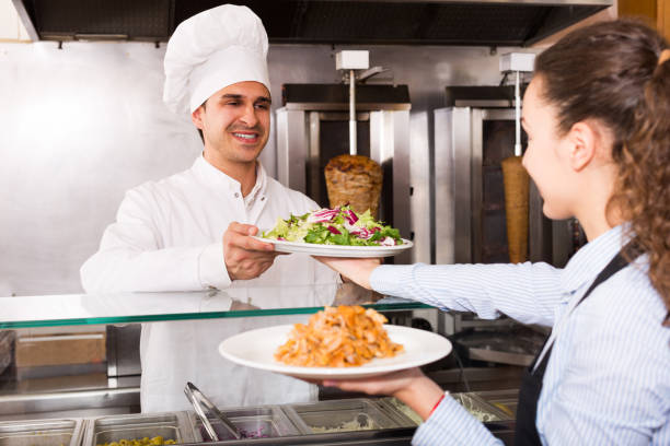 istock Positive waitress receiving order from chef 857001128