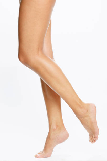 bare female legs - women tan perfection naked imagens e fotografias de stock