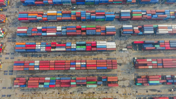 istock Container Cargo freight ship with working crane bridge in shipyard in singapore 857005500