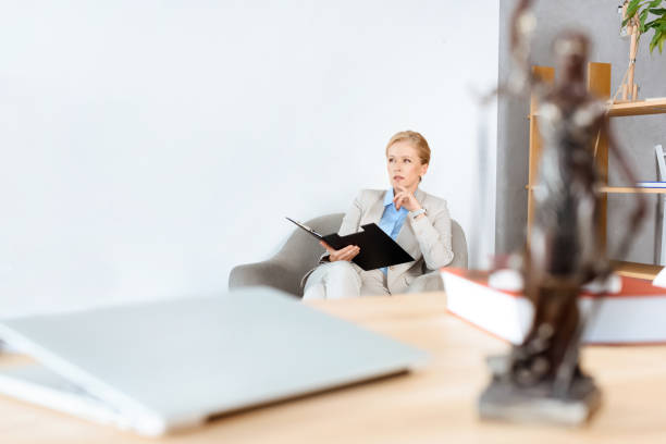 istock businesswoman with folder of documents 857008946