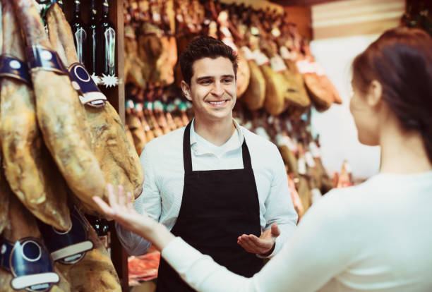 istock Female customer buying Spanish jamon 857015862