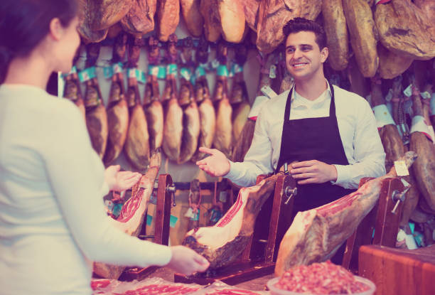 istock Female customer buying Spanish jamon 857015874