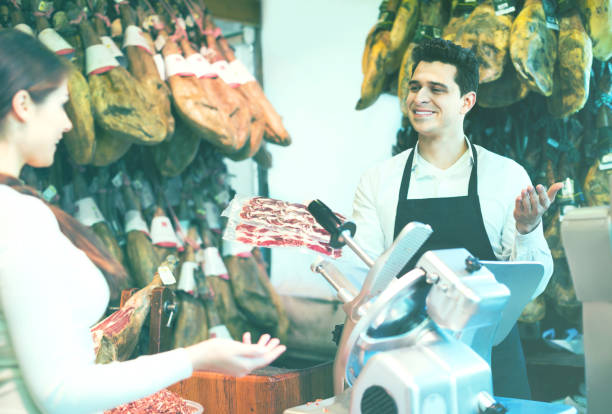 istock Female customer buying Spanish jamon 857015886