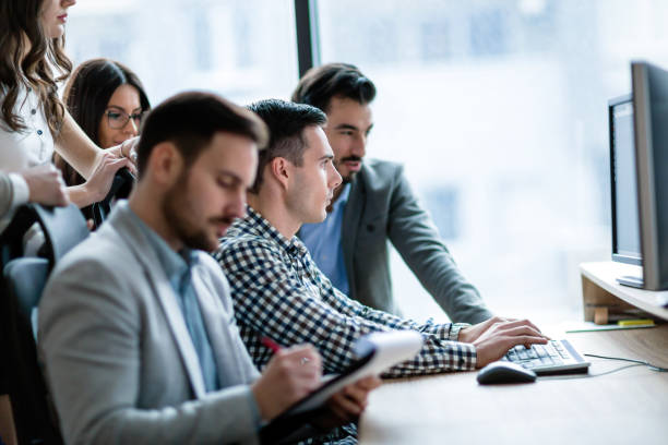 istock Young businesspeople working on computer in office 857017820