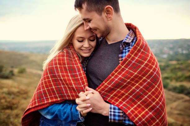 istock Happy couple under a plaid outdoors. 857018002