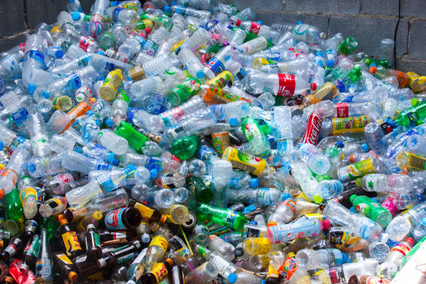 istock Rayong, Thailand-October 2,2017: Close-up view plastic bottles of various drinks in the yard of a company specializing in ecological treatments. Large heap of plastic bottles and containers for recycling. 857021604