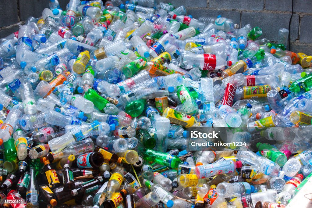 Rayong, Thailand-October 2,2017: Close-up view plastic bottles of various drinks in the yard of a company specializing in ecological treatments. Large heap of plastic bottles and containers for recycling. Plastic Stock Photo