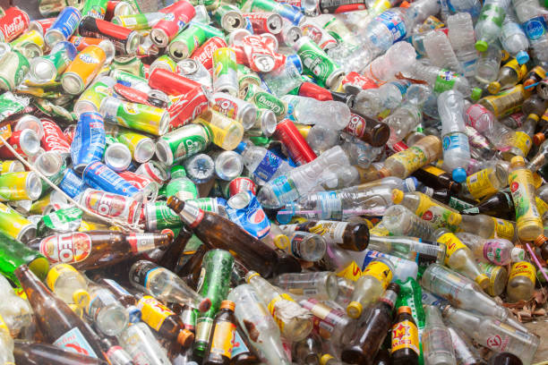 istock Rayong, Thailand-October 2,2017: Close-up view plastic bottles of various drinks in the yard of a company specializing in ecological treatments. Large heap of plastic bottles and containers for recycling. 857021642