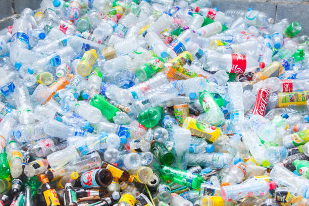 istock Rayong, Thailand-October 2,2017: Close-up view plastic bottles of various drinks in the yard of a company specializing in ecological treatments. Large heap of plastic bottles and containers for recycling. 857021678