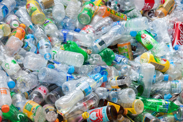 istock Rayong, Thailand-October 2,2017: Close-up view plastic bottles of various drinks in the yard of a company specializing in ecological treatments. Large heap of plastic bottles and containers for recycling. 857021692