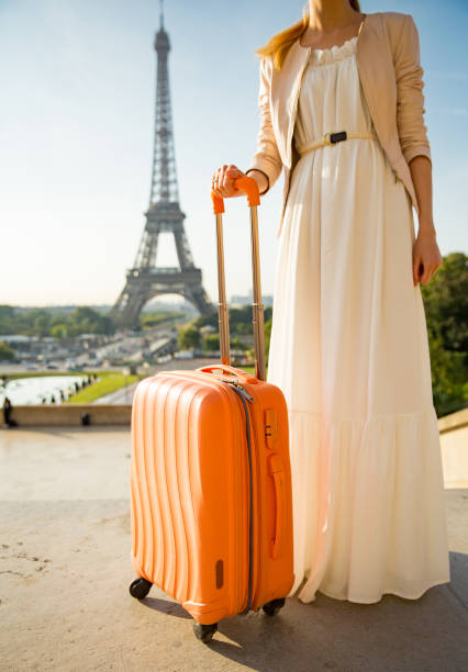 istock Woman with suitcase in Paris 857028096