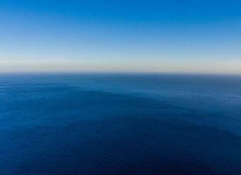 The sea separated from the sky haze. Drone photo.