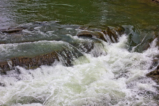 Waterfall on the Prut river in the Ukrainian Carpathians. Water closeup
