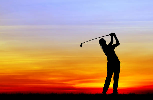 istock silhouette golfer playing golf during beautiful sunset 857031352