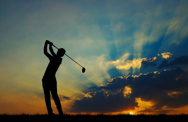 istock silhouette golfer playing golf during beautiful sunset 857031394