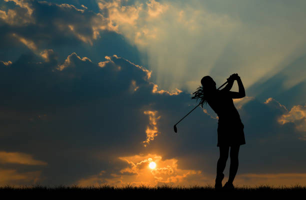 istock silhouette golfer playing golf during beautiful sunset 857031638