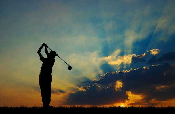 istock silhouette golfer playing golf during beautiful sunset 857031678