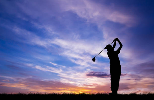 istock silhouette golfer playing golf during beautiful sunset 857031710