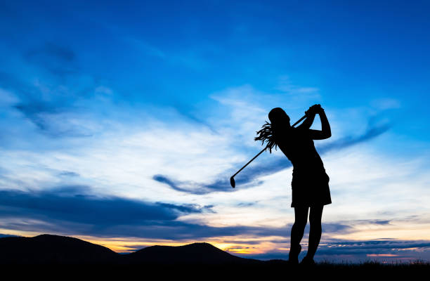 istock silhouette golfer playing golf during beautiful sunset 857031818