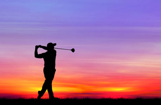 istock silhouette golfer playing golf during beautiful sunset 857031836