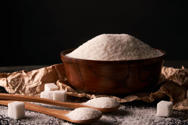 istock Bowl of white Sugar and sugar cubes 857032050