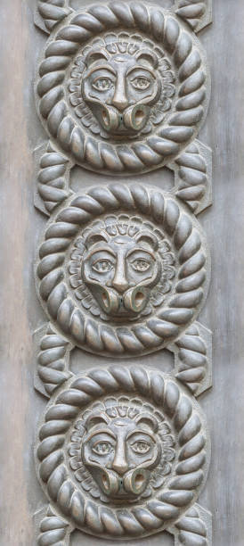 istock Seamless texture of ancient iron gate with lion head decor element. 857036934