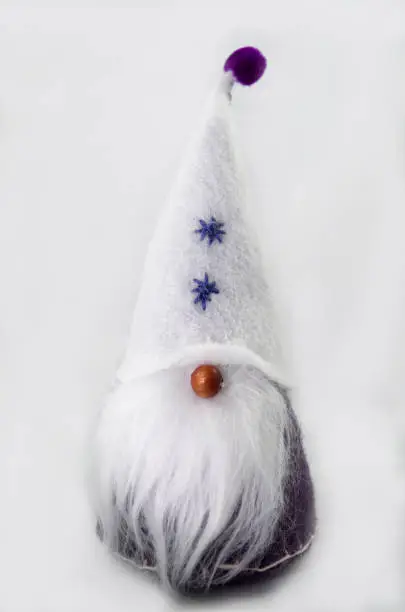 Gnome with white hat and purple pom pom