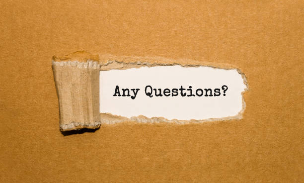 istock The text Any Questions appearing behind torn brown paper 857037192