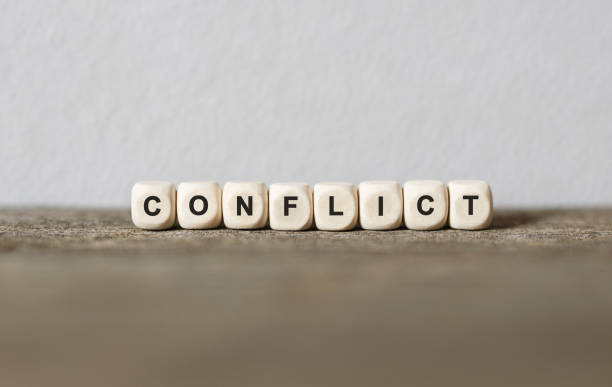 istock Word CONFLICT made with wood building blocks 857037316