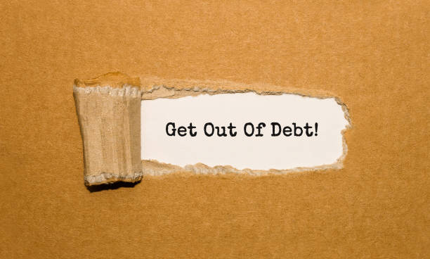 istock The text Get Out Of Debt appearing behind torn brown paper 857037432