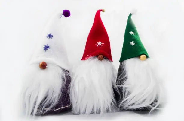 Three gnomes with decorated hats