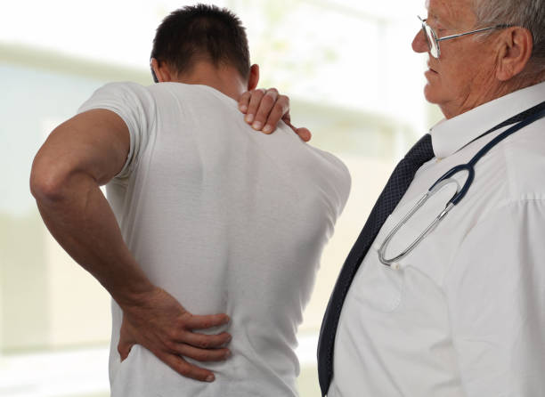 istock Muscular Man suffering from back and neck pain. Incorrect sitting posture problems Muscle spasm, rheumatism. Pain relief, ,chiropractic concept. Sport exercising injury 857040722