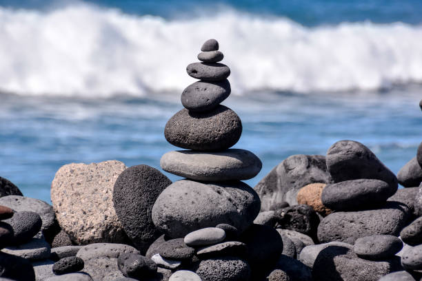 istock Stack of stones on the sea beach 857041508