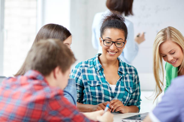 istock group of happy high school students with workbook 857044446